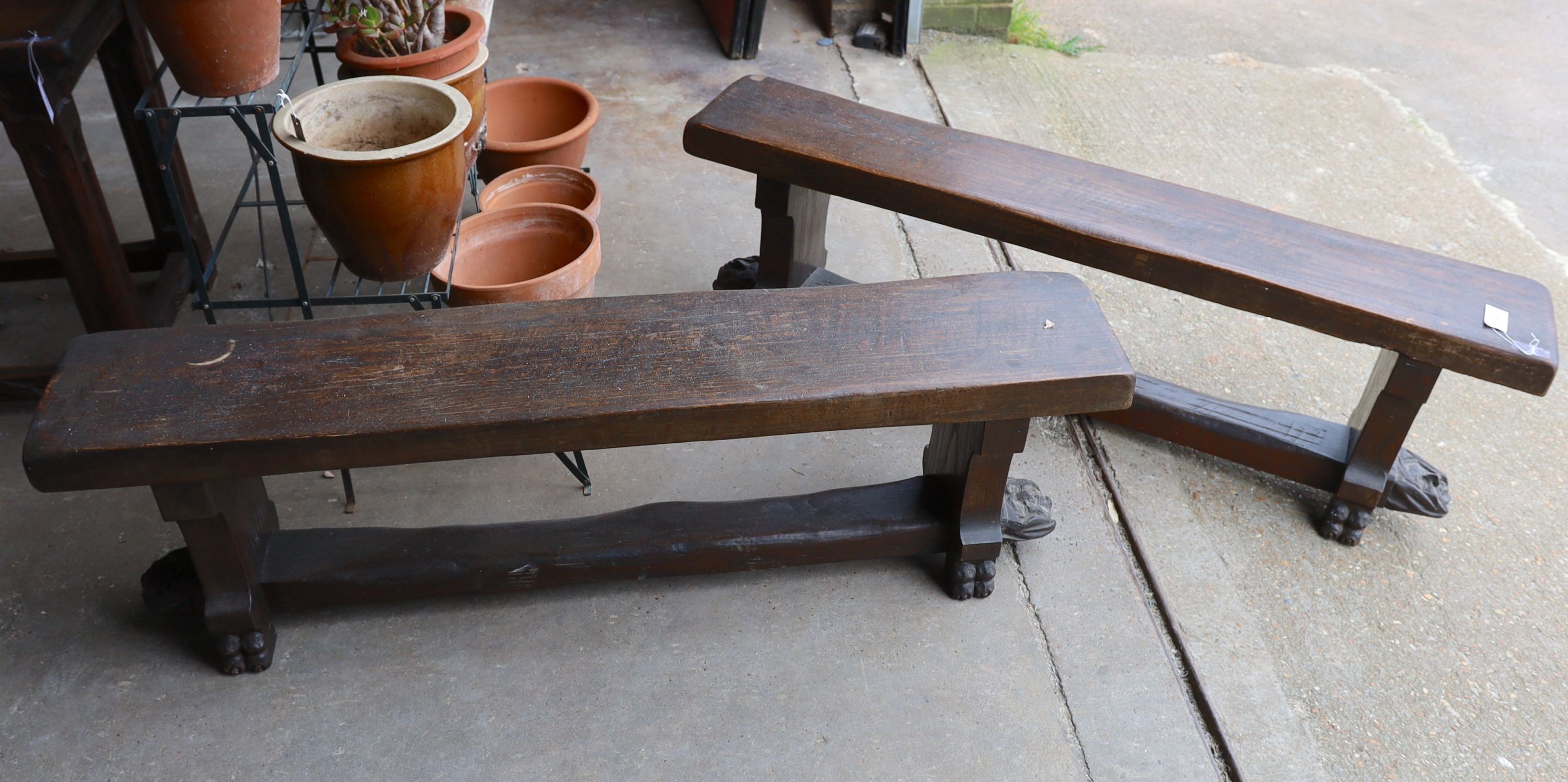 A pair of 17th century style carved oak New England benches, length 150cm, depth 28cm, height 46cm